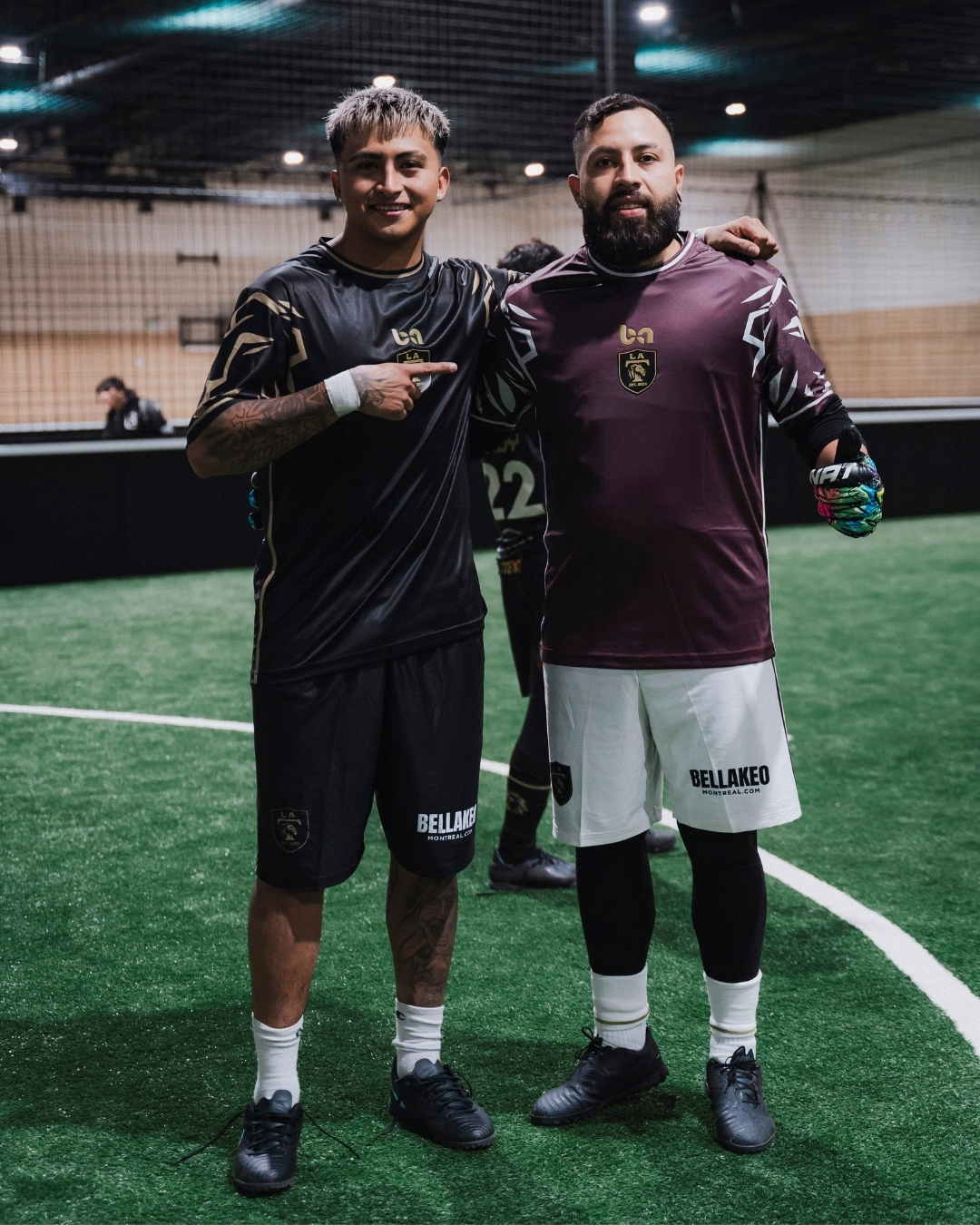 ba Gear custom soccer kits, players wearing black and maroon uniforms posing on indoor field